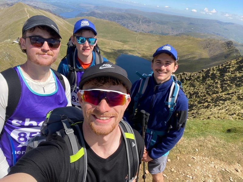 boys at the peak of summit at the lake district