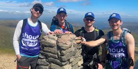 People on the summit of The Lakes 3000