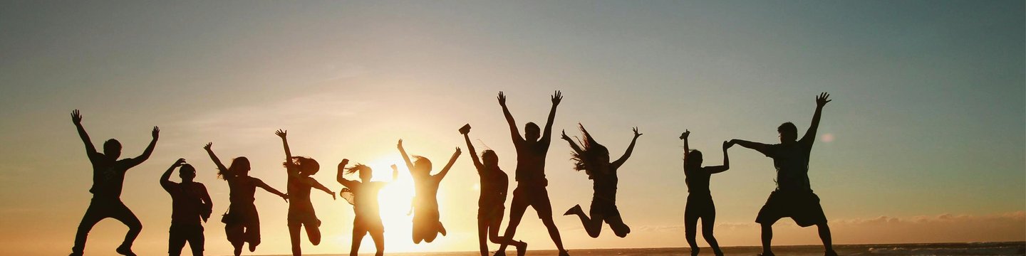 A group of people jumping in the air together