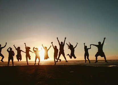 A group of people jumping in the air together