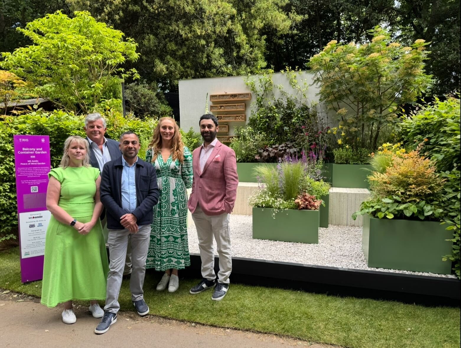 Group photo in front of the garden at Chelsea Flower Show