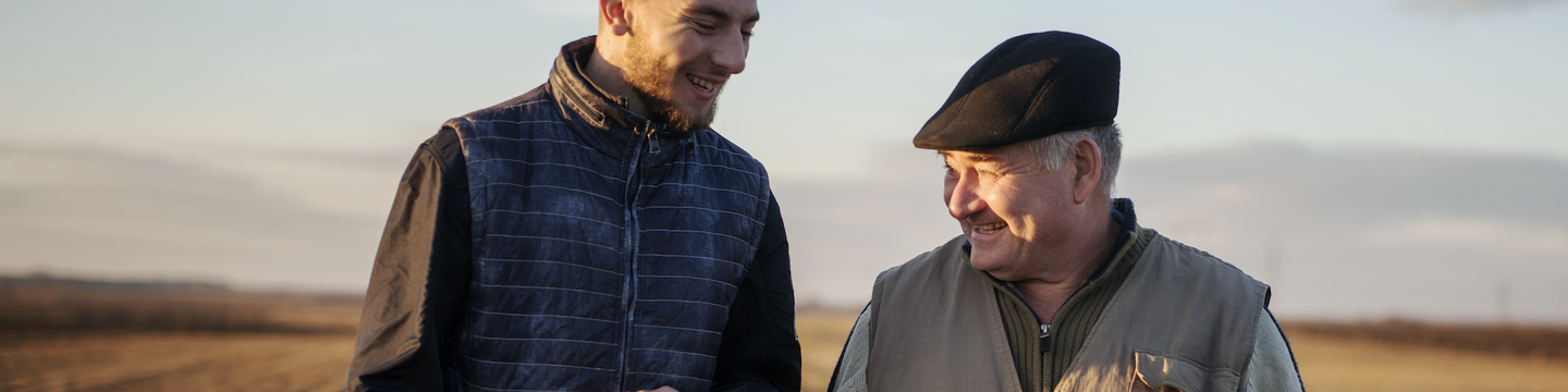 two farmers in a golden field
